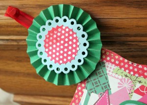 Create a rosette with leftover supplies to finish off the ends of the banner.