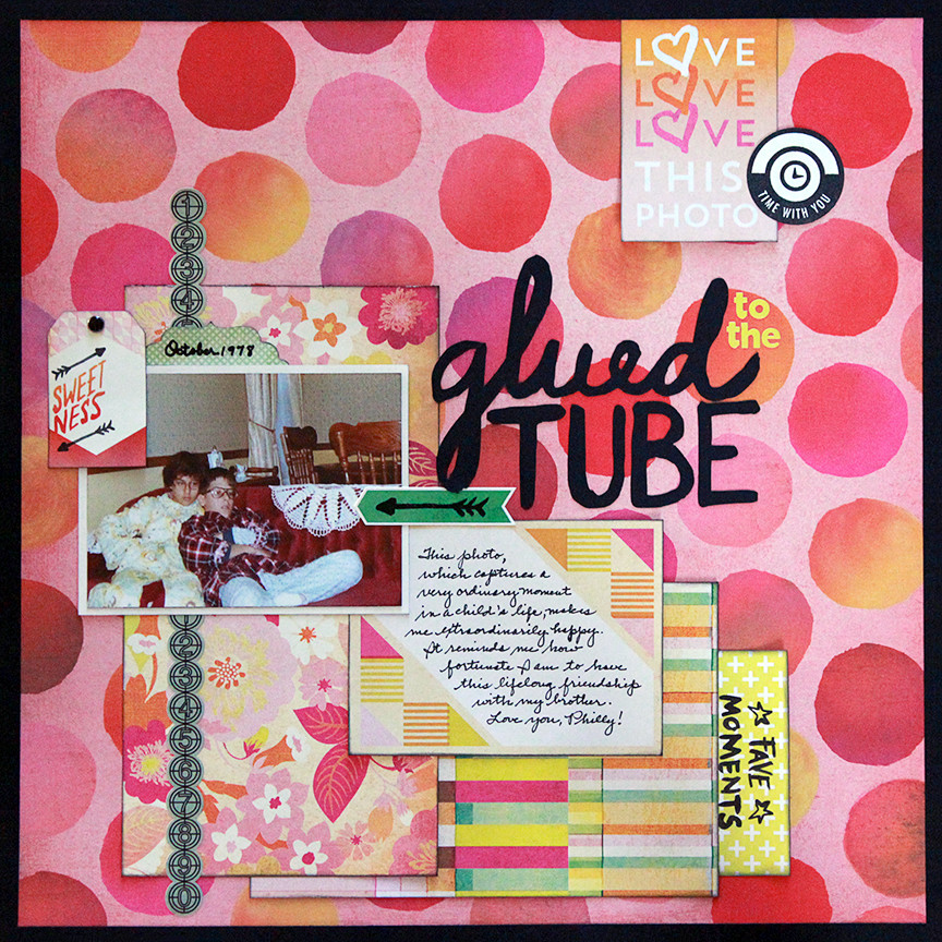 Glued to the tube is a one-photo scrapbook page using BasicGrey's Highline collection.
